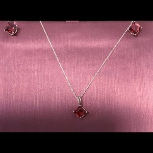 Garnet Square Pendant set in 10kt on a 18 inch chain.